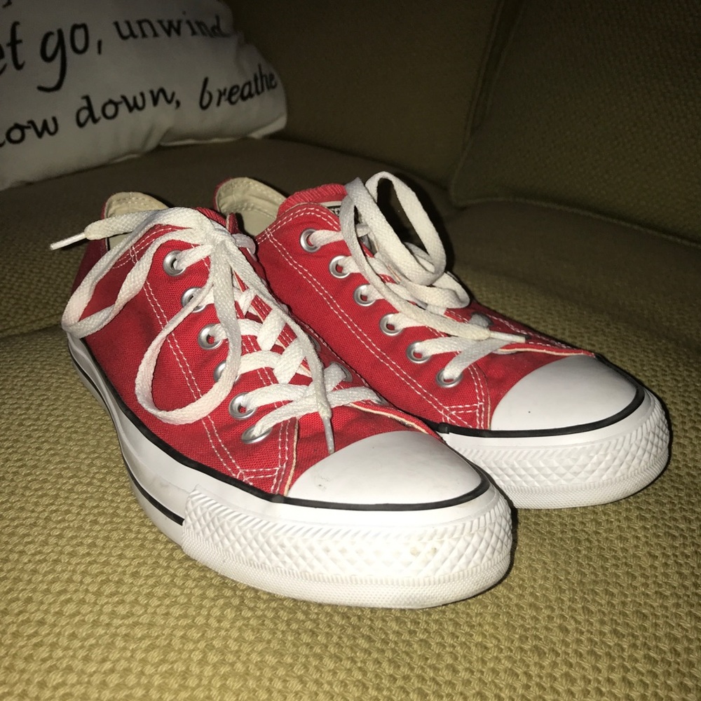 Red low-top Converse sneakers